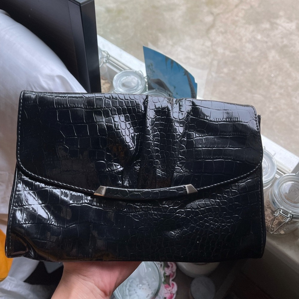 Black alligator print hand purse.